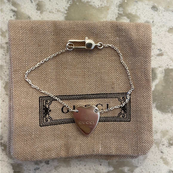 Gucci Jewelry - NWT GUCCI trademark bracelet with heart pendant.